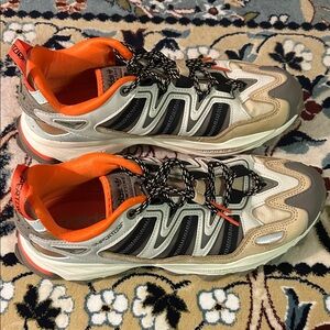 Adidas Tan and Black Shoes with Vibrant Orange Accents